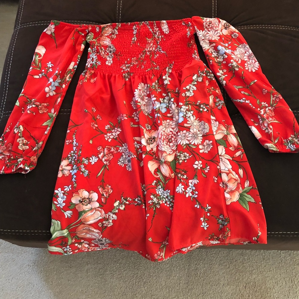 Red strapless floral dress with sleeves.